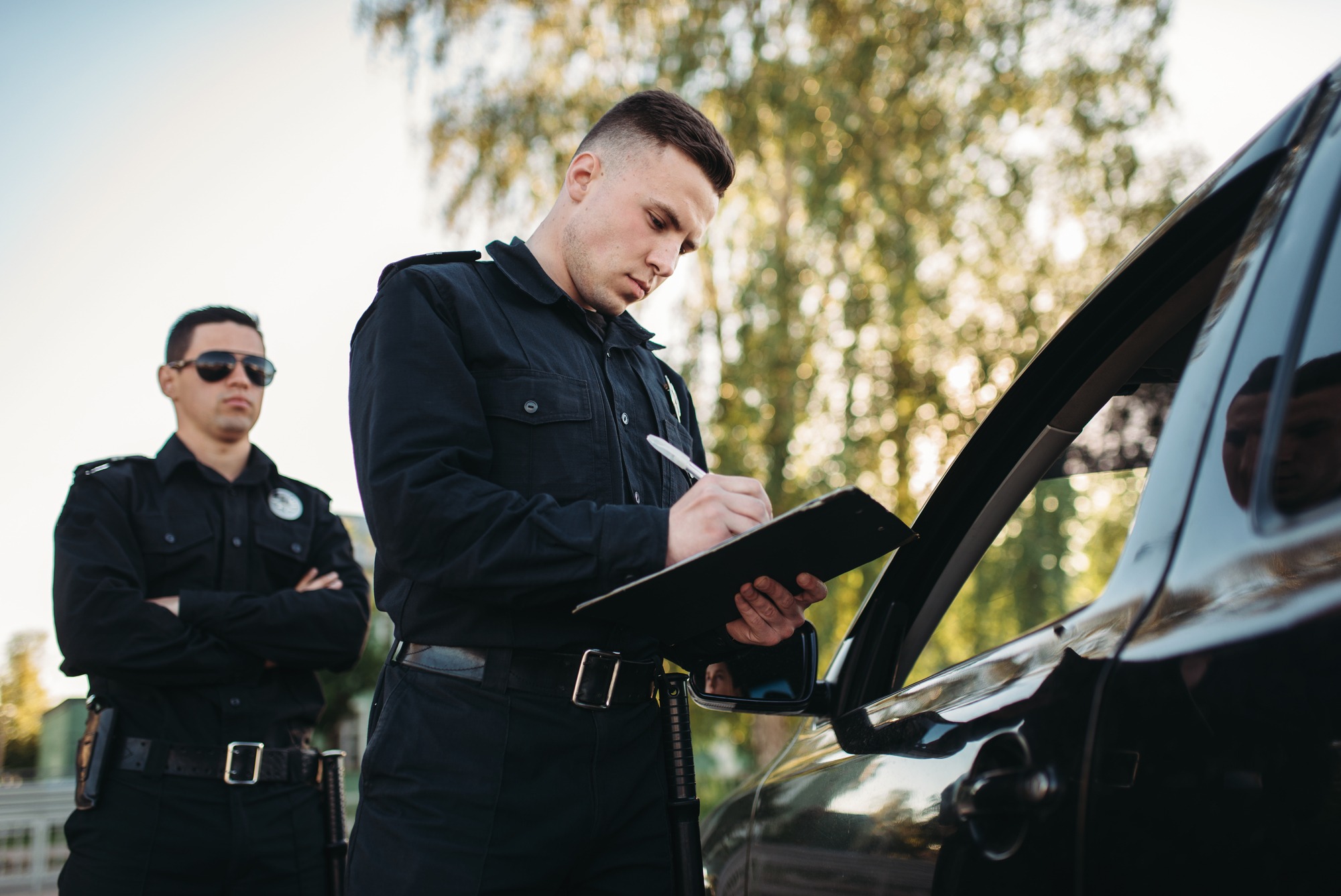 Security Checking Black Vehicle